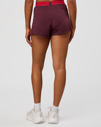 Woman wearing Accelerate 3" High-Rise Running Short - Cherry Lacquer-Scarlet | Model:Rosie | Size:S |