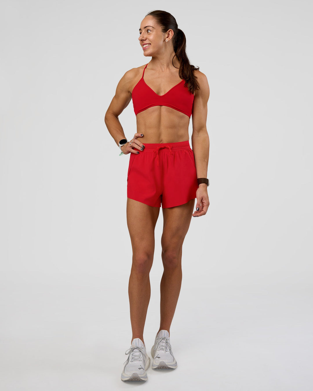 Woman wearing Accelerate 3" High-Rise Running Short - Flame | Model:Zara | Size:S