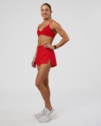 Woman wearing Accelerate 3" High-Rise Running Short - Flame | Model:Zara | Size:S
