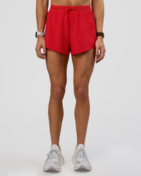 Woman wearing Accelerate 3" High-Rise Running Short - Flame | Set:true | Angle:front | Model:Zara | Size:S