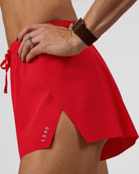 Woman wearing Accelerate 3" High-Rise Running Short - Flame | Model:Zara | Size:S