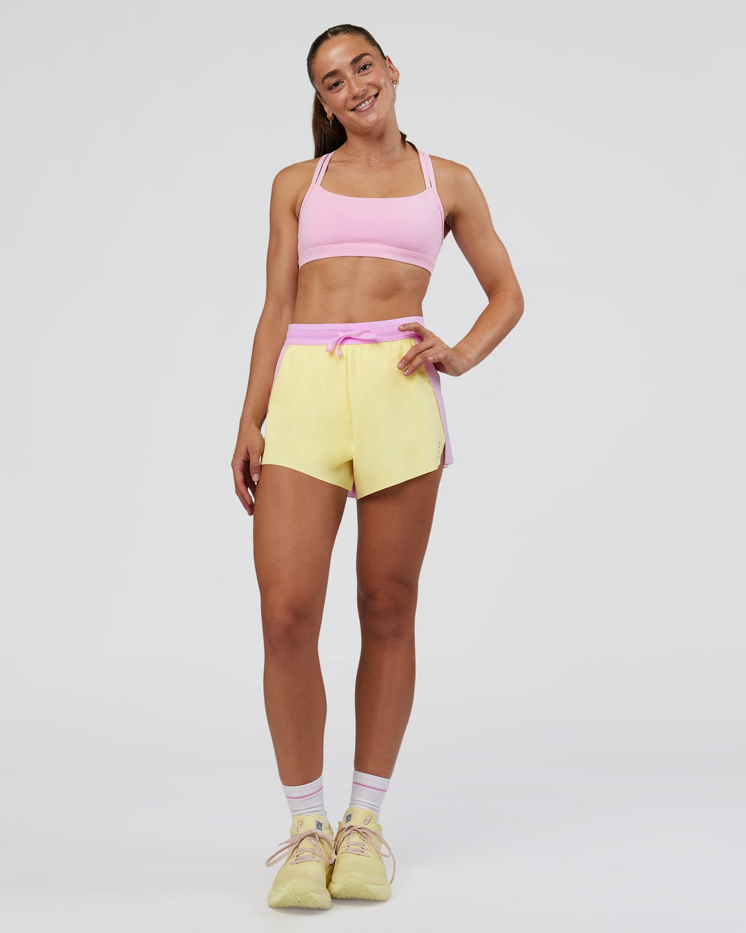 Woman wearing Accelerate 3&quot; High-Rise Running Short - Marshmallow-Lemon | Model:Grace | Size:S