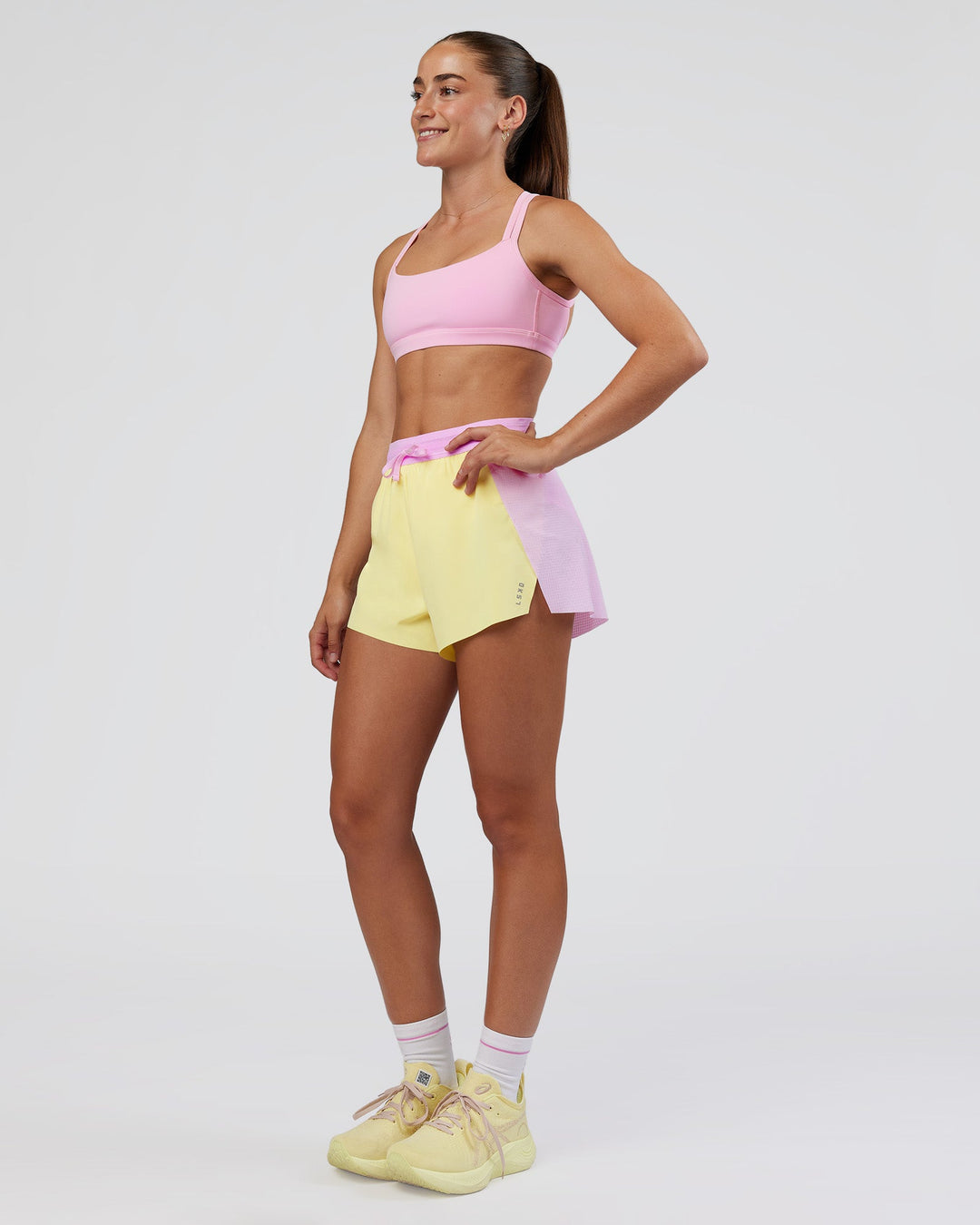 Woman wearing Accelerate 3&quot; High-Rise Running Short - Marshmallow-Lemon | Model:Grace | Size:S