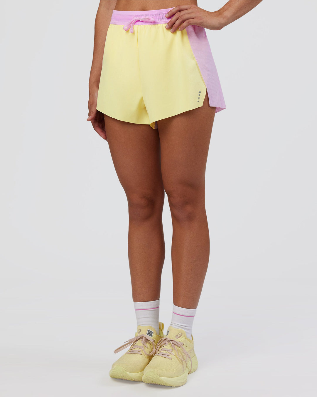 Woman wearing Accelerate 3&quot; High-Rise Running Short - Marshmallow-Lemon | Model:Grace | Size:S