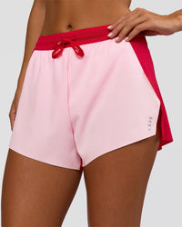 Woman wearing Accelerate 3" High-Rise Running Short - Scarlet-Marshmallow | Set:true | Angle:closeup | Model:Amity | Size:S