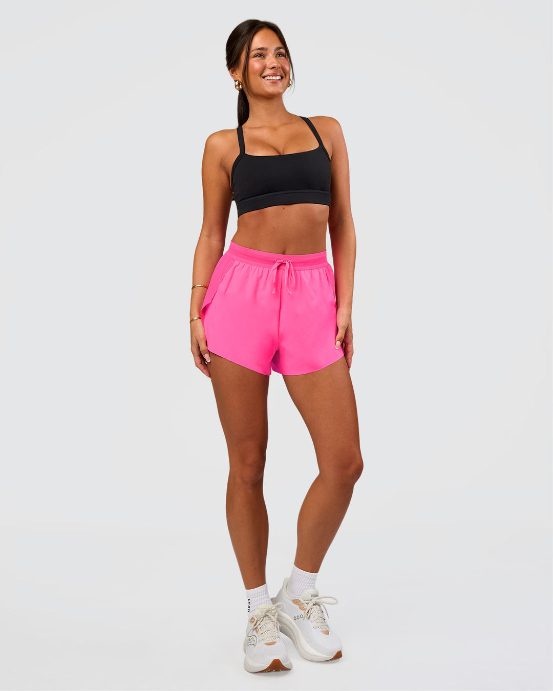 Woman wearing Accelerate 3" High-Rise Running Short - Sugar Plum | Set:true | Angle:side | Model:Bianca | Size:S