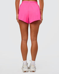Woman wearing Accelerate 3" High-Rise Running Short - Sugar Plum | Set:true | Angle:side | Model:Bianca | Size:S