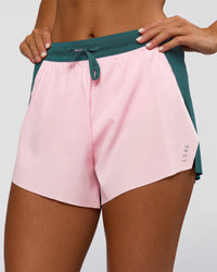 Woman wearing Accelerate 3" High-Rise Running Short - Transformative Teal-Marshmallow | Set:true | Angle:closeup | Model:Amity | Size:S