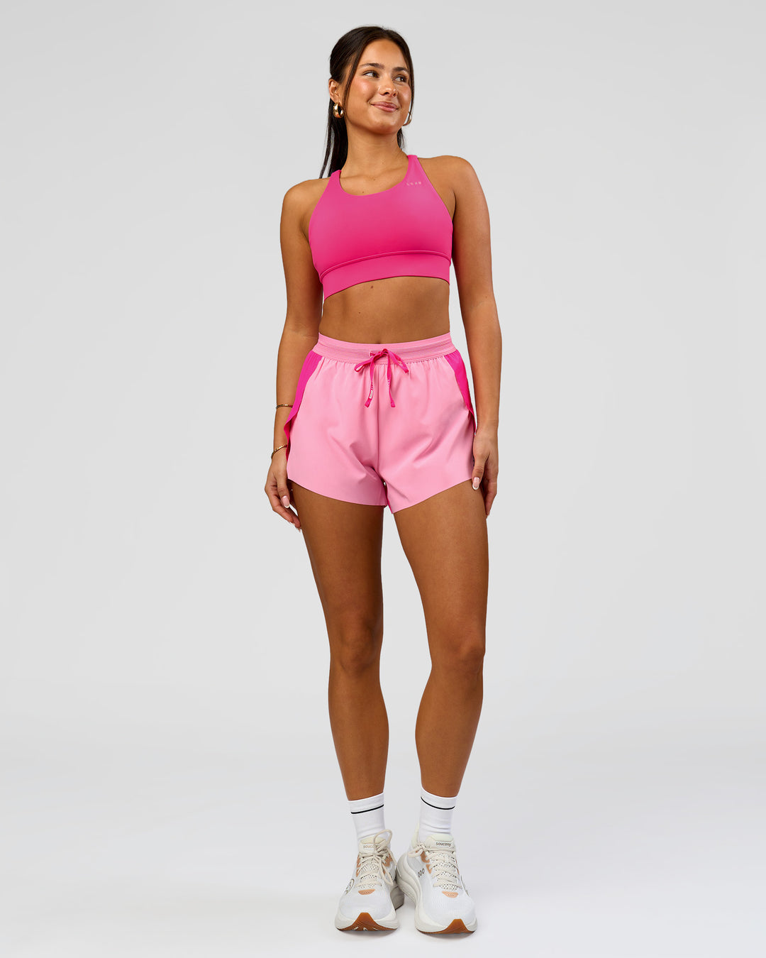 Woman wearing Accelerate 3" High-Rise Running Short - Ultra Pink-Candy Pink | Model:Bianca | Size:S