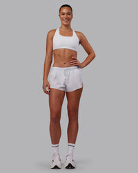 Woman wearing Accelerate 3" Running Short - White | Model:Charlize | Size:S