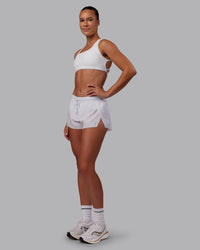 Woman wearing Accelerate 3" Running Short - White | Model:Charlize | Size:S