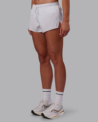 Woman wearing Accelerate 3" Running Short - White | Model:Charlize | Size:S