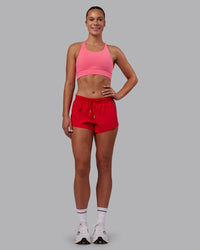 Woman wearing Accelerate Run Shorts - Scarlet | Model:Charlize | Size:S