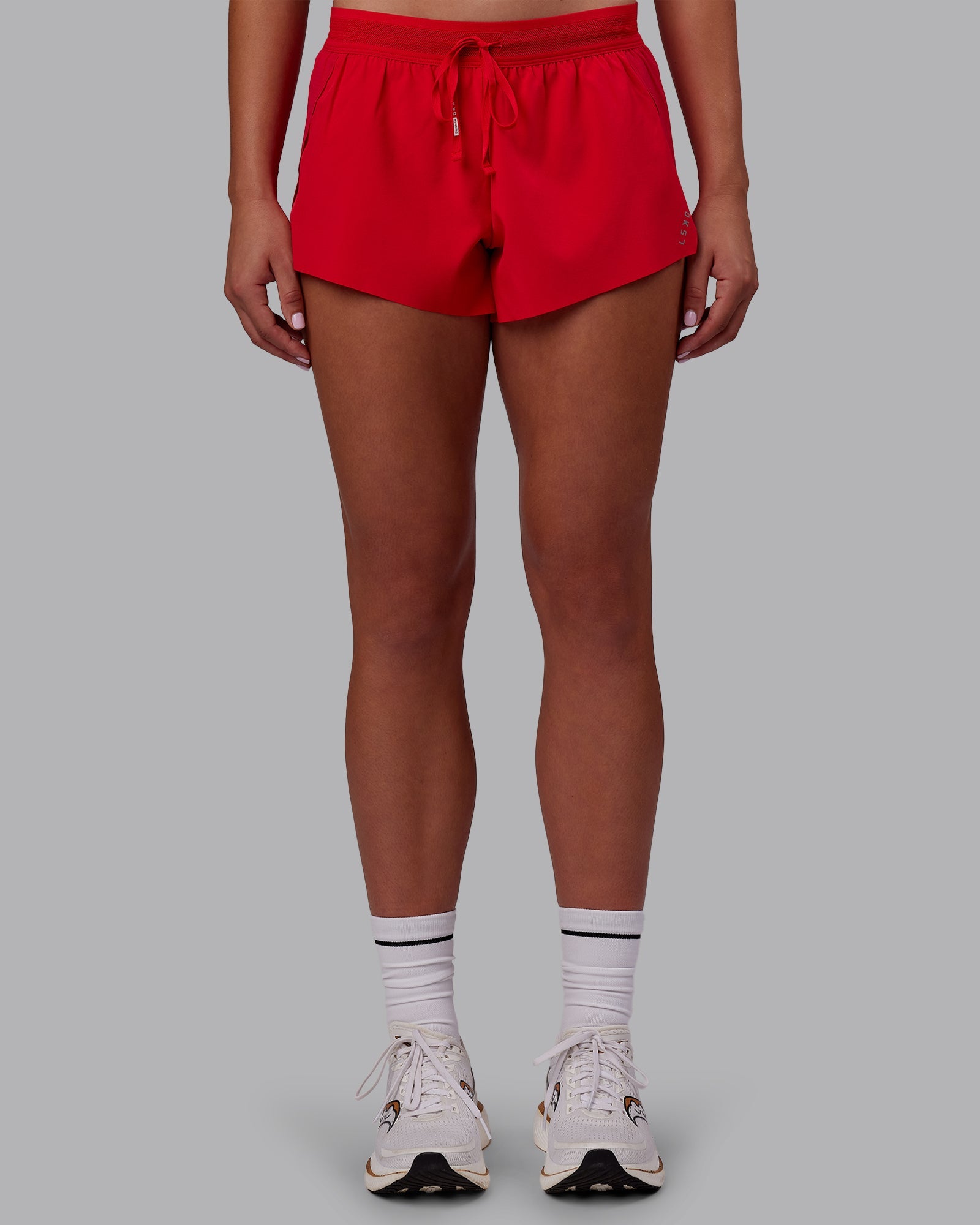 Woman wearing Accelerate Run Shorts - Scarlet | Model:Charlize | Size:S