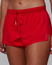 Woman wearing Accelerate Run Shorts - Scarlet | Model:Charlize | Size:S