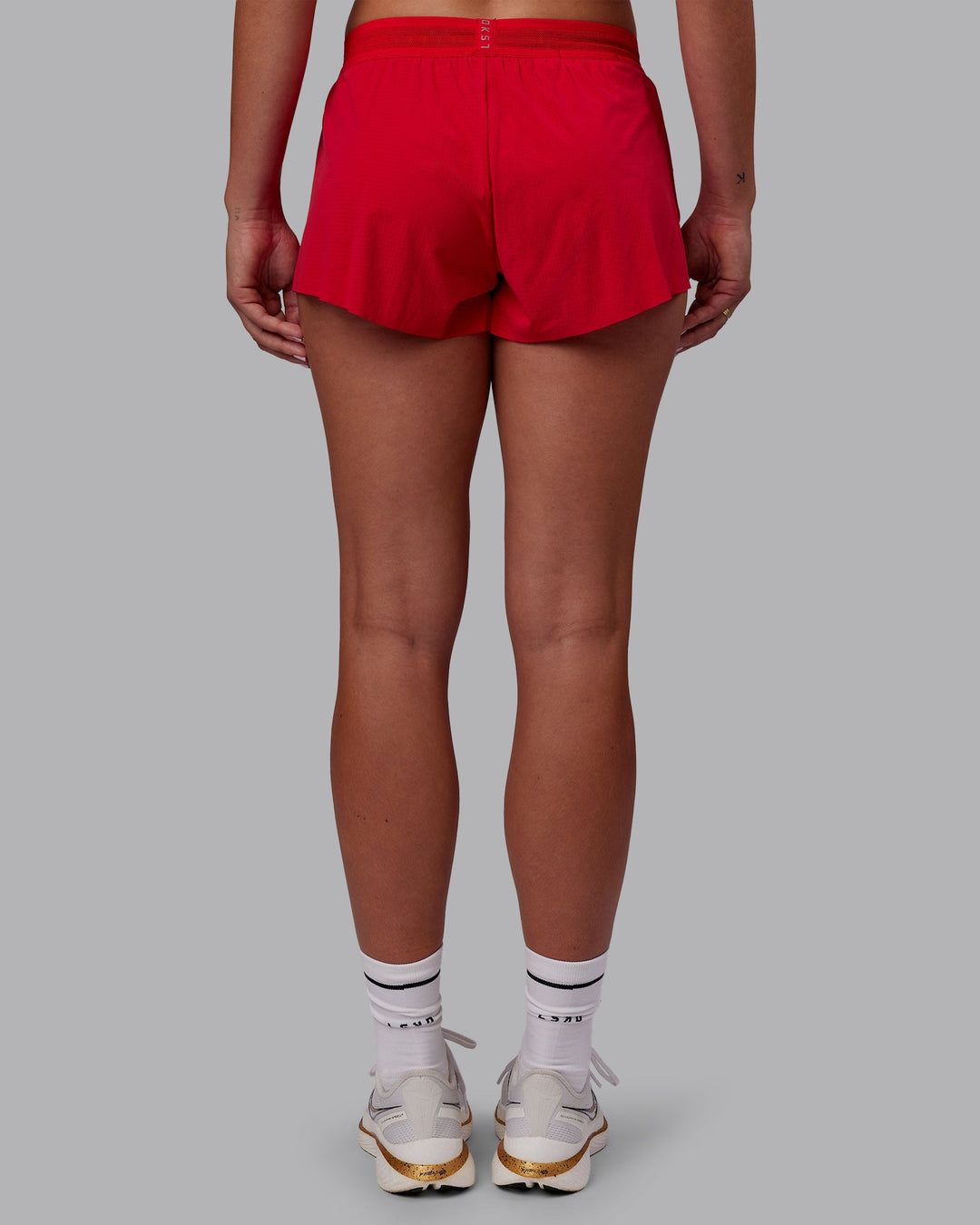 Woman wearing Accelerate Run Shorts - Scarlet | Model:Charlize | Size:S