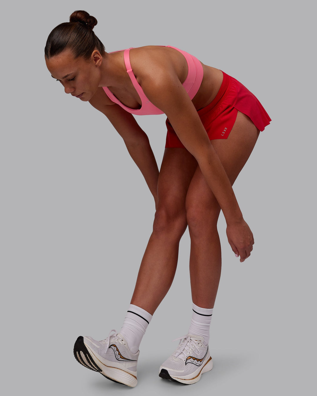 Woman wearing Accelerate Run Shorts - Scarlet | Model:Charlize | Size:S