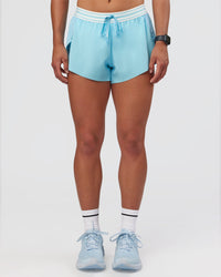 Woman wearing Accelerate 3" Mid-Rise Running Short - Baltic Sea-Off White | Set:true | Angle:front | Model:Keisha | Size:S