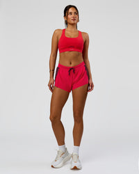 Woman wearing Accelerate 3" Mid-Rise Running Short - Cherry Lacquer-Scarlet | Model:Bianca | Size:S | | Thumbnail Index: 4