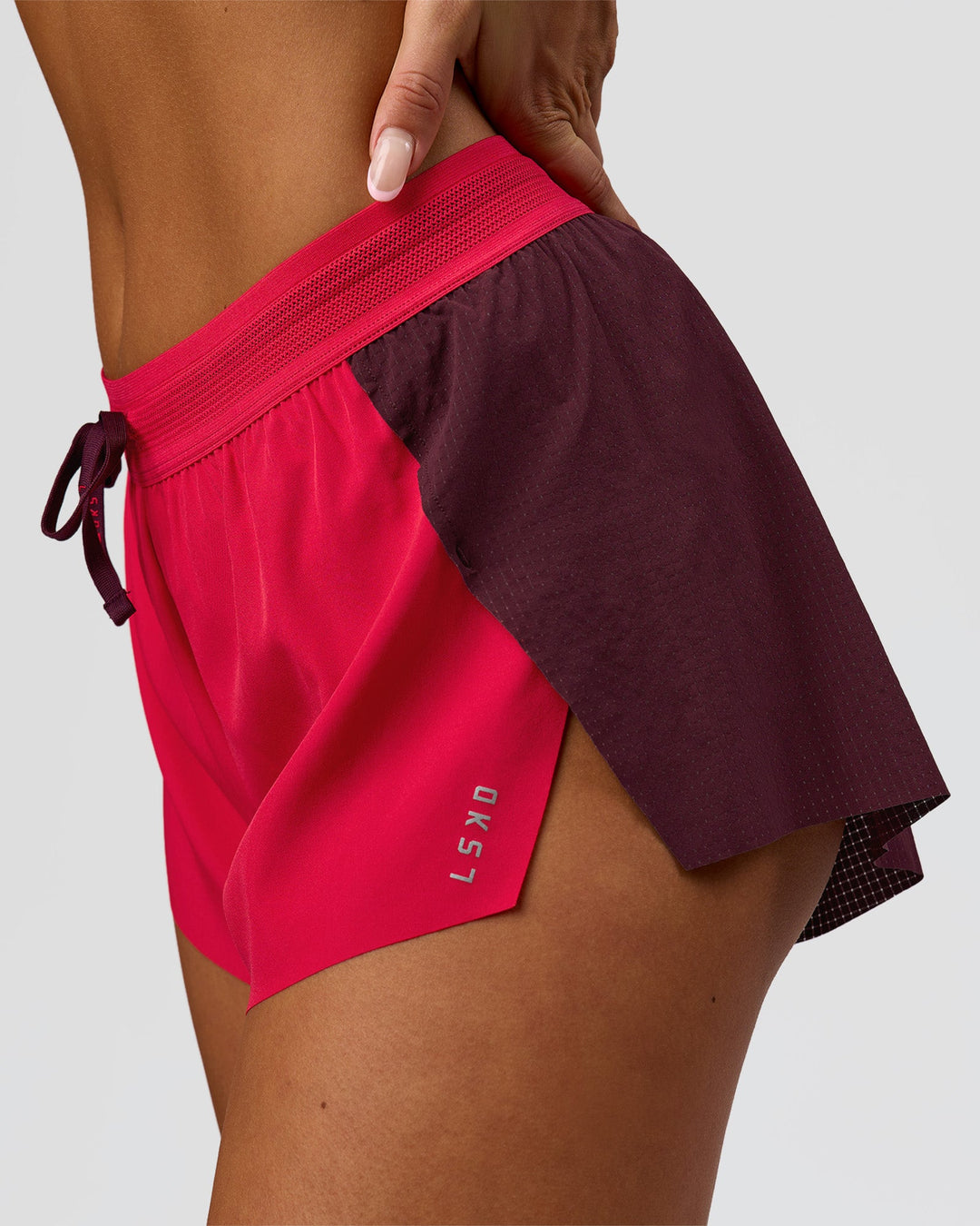 Woman wearing Accelerate 3" Mid-Rise Running Short - Cherry Lacquer-Scarlet | Model:Bianca | Size:S | - view 2