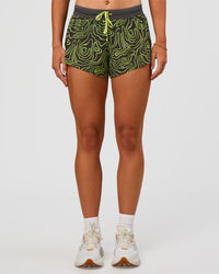 Woman wearing Accelerate 3" Mid-Rise Running Short - Friction Print Hyper Green | Set:true | Angle:front | Model:Emelia | Size:S