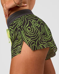 Woman wearing Accelerate 3" Mid-Rise Running Short - Friction Print Hyper Green | Model:Emelia | Size:S