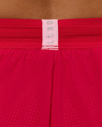 Woman wearing Accelerate 3" Mid-Rise Running Short - Scarlet-Marshmallow | Model:Amity | Size:S