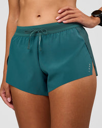 Woman wearing Accelerate 3" Mid-Rise Running Short - Transformative Teal | Set:true | Angle:closeup | Model:Rhiley | Size:S