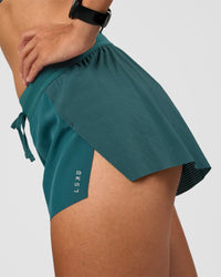 Woman wearing Accelerate 3" Mid-Rise Running Short - Transformative Teal | Model:Rhiley | Size:S