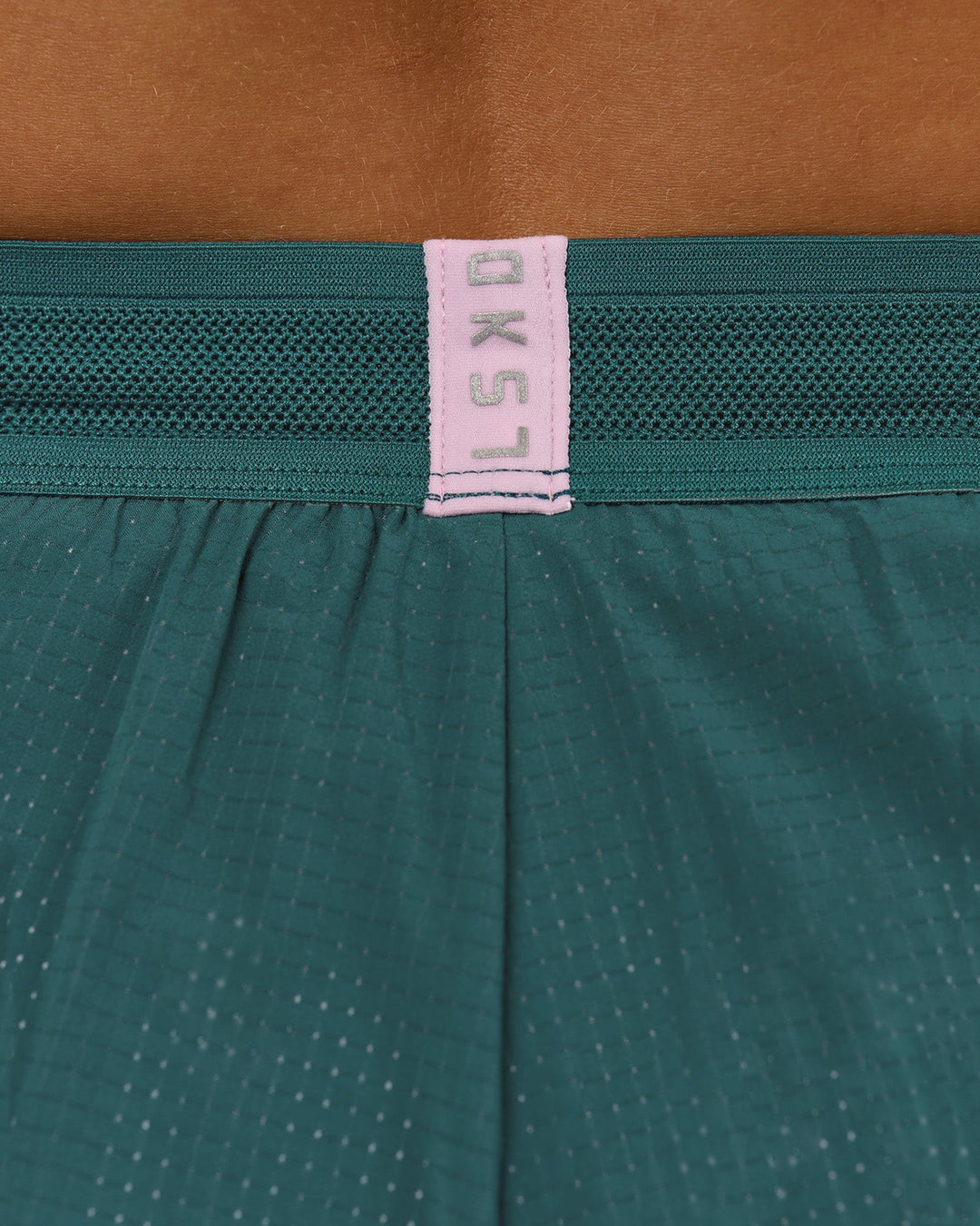 Woman wearing Accelerate 3" Mid-Rise Running Short - Transformative Teal-Marshmallow | Model:Amity | Size:S