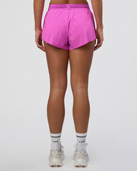 Woman wearing Accelerate 3" Mid-Rise Running Short - Ultra Fuchsia | Set:true | Angle:back | Model:Amity | Size:S