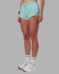 Woman wearing Accelerate 3" Running Short - Island Paradise | Set:true | Angle:side | Model:Shae | Size:S