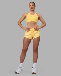 Woman wearing Accelerate 3" Running Short - Lemon | Model:Sophie | Size:S