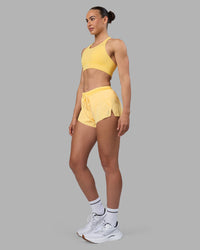 Woman wearing Accelerate 3" Running Short - Lemon | Model:Sophie | Size:S