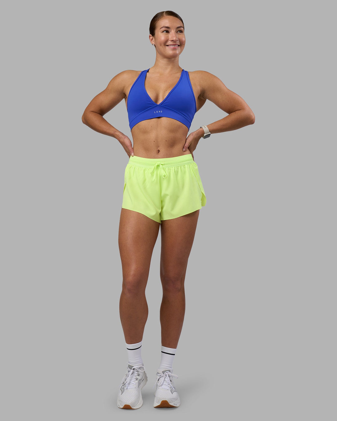 Woman wearing Accelerate 3&quot; Running Short - Lime Glo | Model:Hannah | Size:S