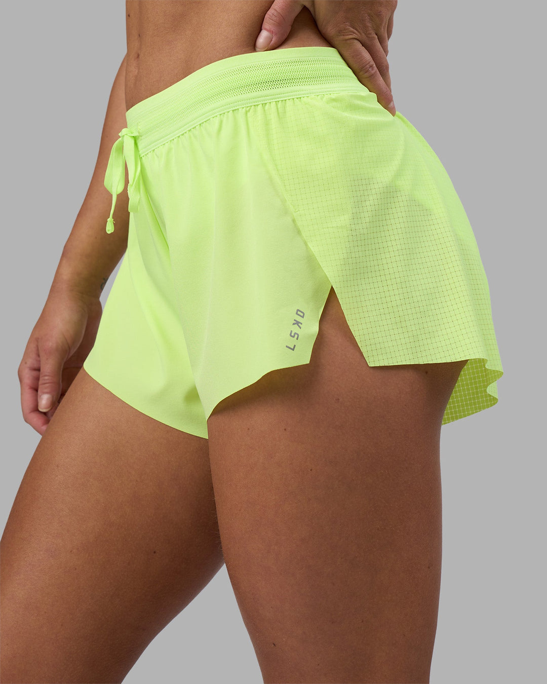 Woman wearing Accelerate 3&quot; Running Short - Lime Glo | Model:Hannah | Size:S