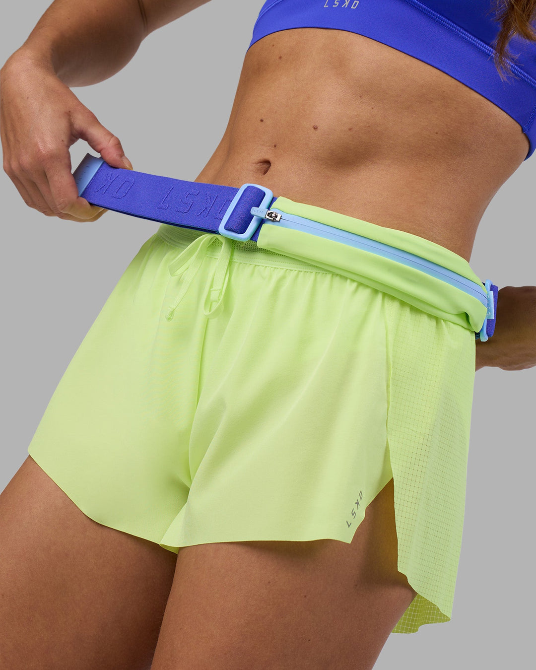 Woman wearing Accelerate 3&quot; Running Short - Lime Glo | Model:Hannah | Size:S
