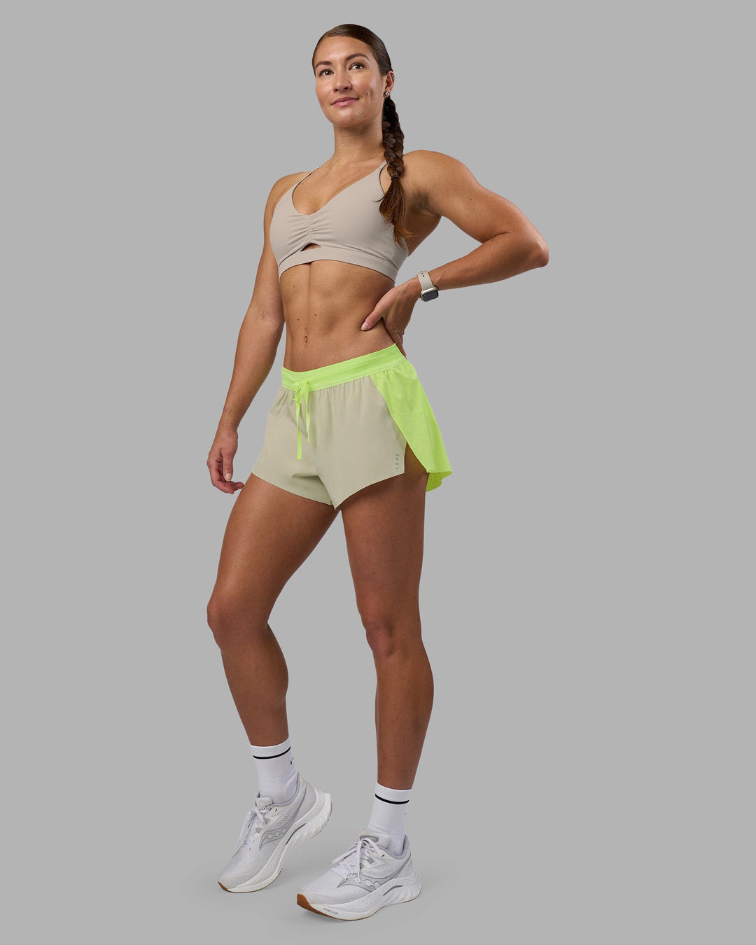 Woman wearing Accelerate 3&quot; Running Short - Lime Glo-Shale Beige | Model:Hannah | Size:S