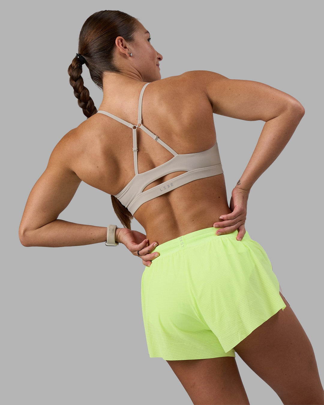 Woman wearing Accelerate 3&quot; Running Short - Lime Glo-Shale Beige | Model:Hannah | Size:S