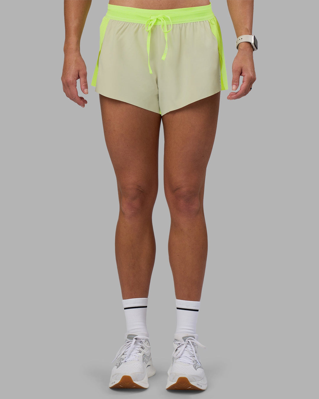 Woman wearing Accelerate 3&quot; Running Short - Lime Glo-Shale Beige | Model:Hannah | Size:S
