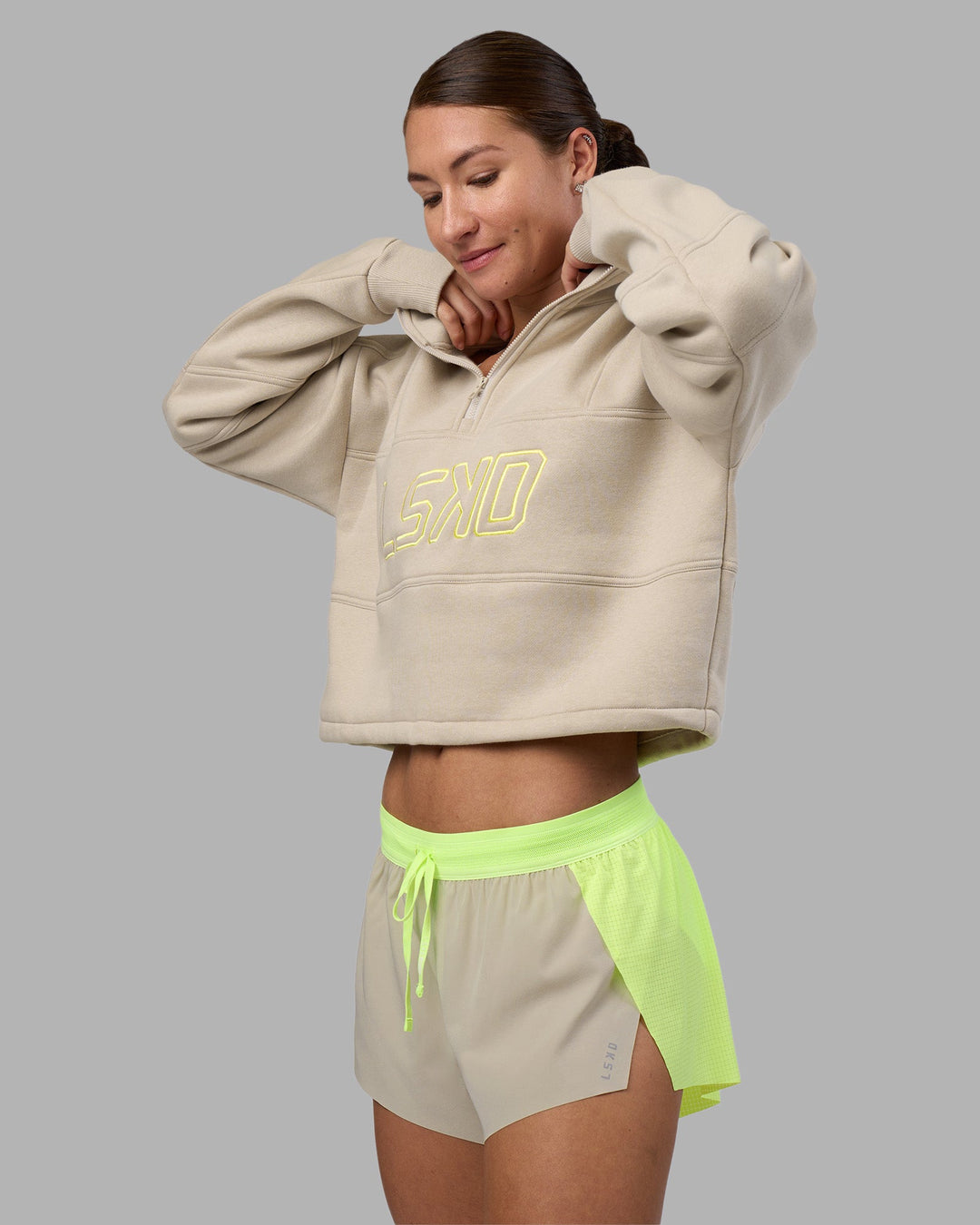 Woman wearing Accelerate 3&quot; Running Short - Lime Glo-Shale Beige | Model:Hannah | Size:S