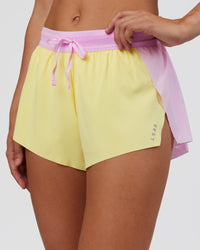 Woman wearing Accelerate 3" Mid-Rise Running Short - Marshmallow-Lemon | Set:true | Angle:closeup | Model:Grace | Size:S