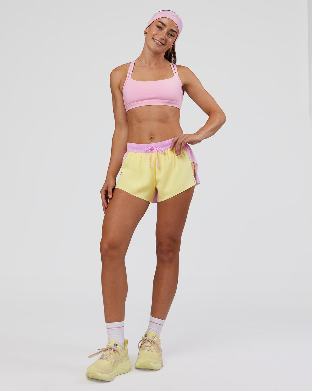 Woman wearing Accelerate 3" Mid-Rise Running Short - Marshmallow-Lemon | Model:Grace | Size:S