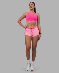 Woman wearing Accelerate 3" Running Short - Ultra Pink-Candy Pink | Model:Rhiley | Size:S