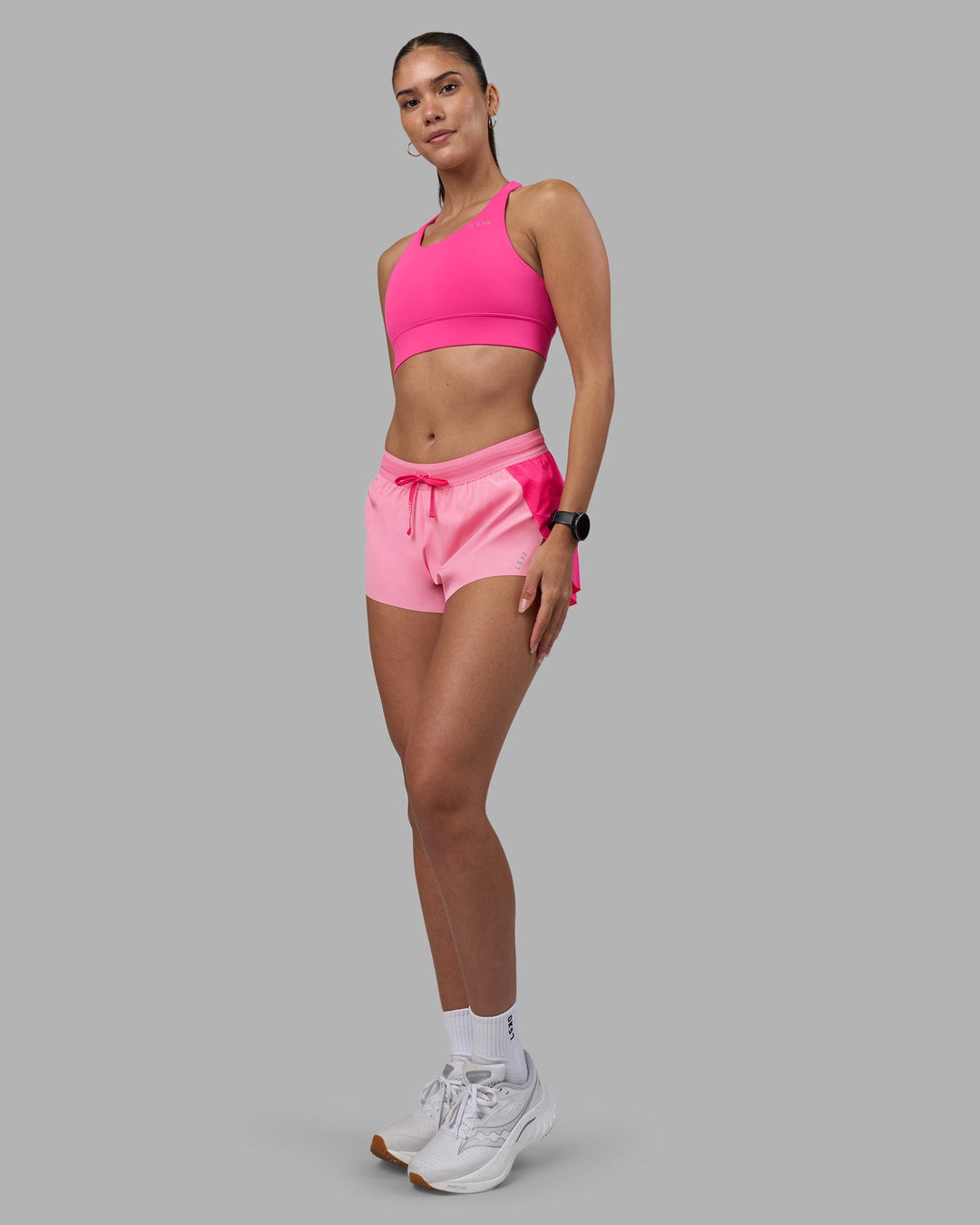 Woman wearing Accelerate 3" Running Short - Ultra Pink-Candy Pink | Model:Rhiley | Size:S