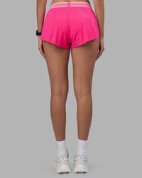 Woman wearing Accelerate 3" Running Short - Ultra Pink-Candy Pink | Set:true | Angle:back | Model:Rhiley | Size:S