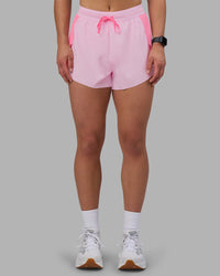 Woman wearing Accelerate 3" High-Rise Running Short - Candy Pink-Marshmallow | Set:true | Angle:front | Model:Keisha | Size:S