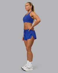 Woman wearing Accelerate 3" Run Short in Power Cobalt | Model:Shalem | Size:S