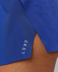 Woman wearing Accelerate 3" Run Short in Power Cobalt | Model:Shalem | Size:S