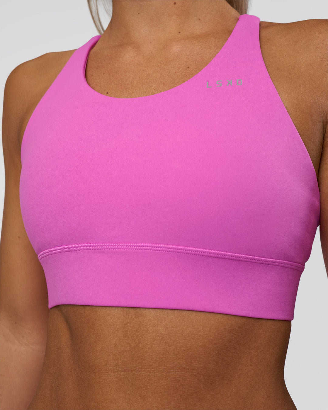 Woman wearing Accelerate Split Strap Sports Bra - Ultra Fuchsia | Model:Amity | Size:S